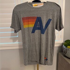 Aviator Nation Gray Tee with Blue AV Logo and Red-Orange-Yellow Stripes
